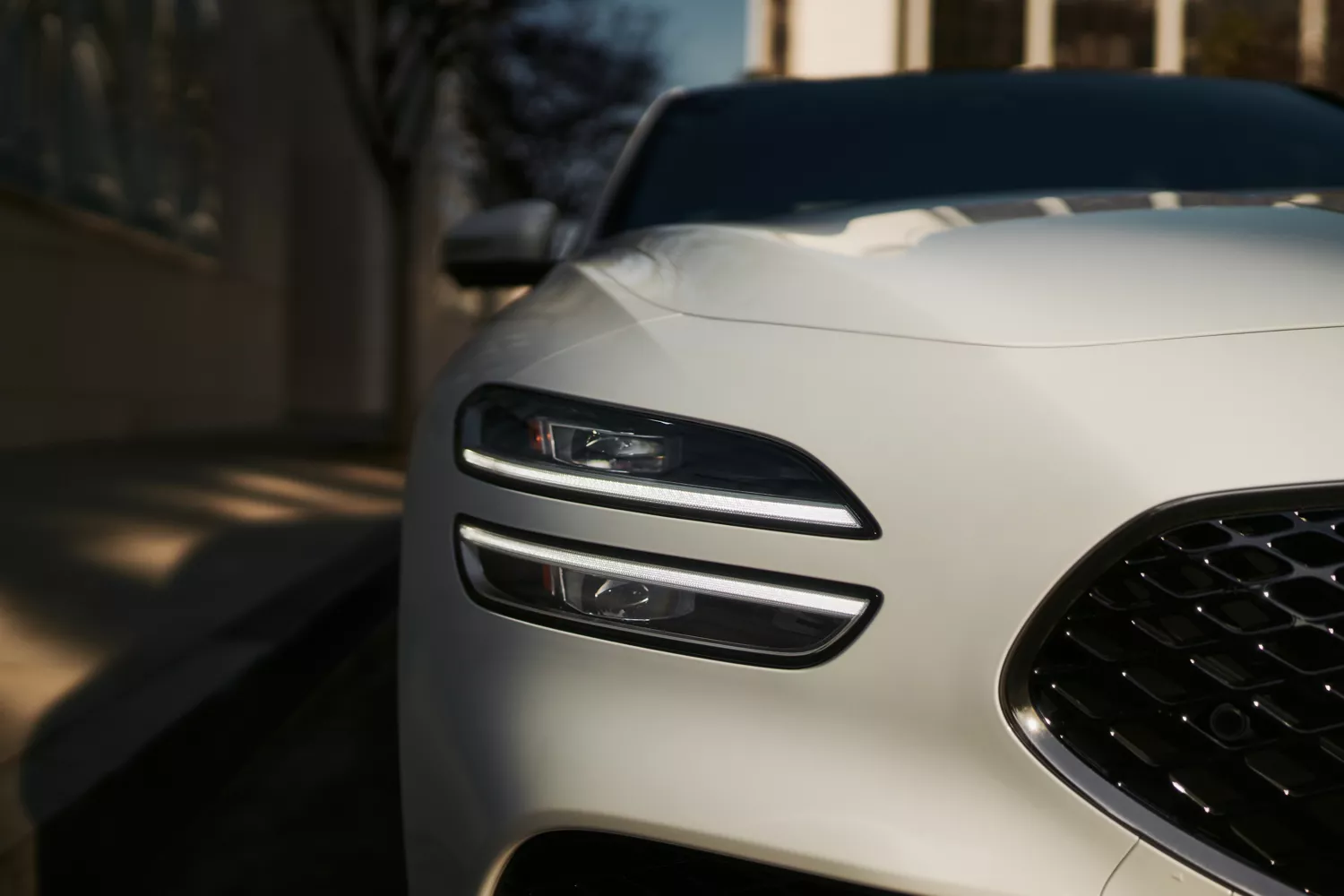 "Design Details" component with close up of Alta White Genesis G70 headlamp below